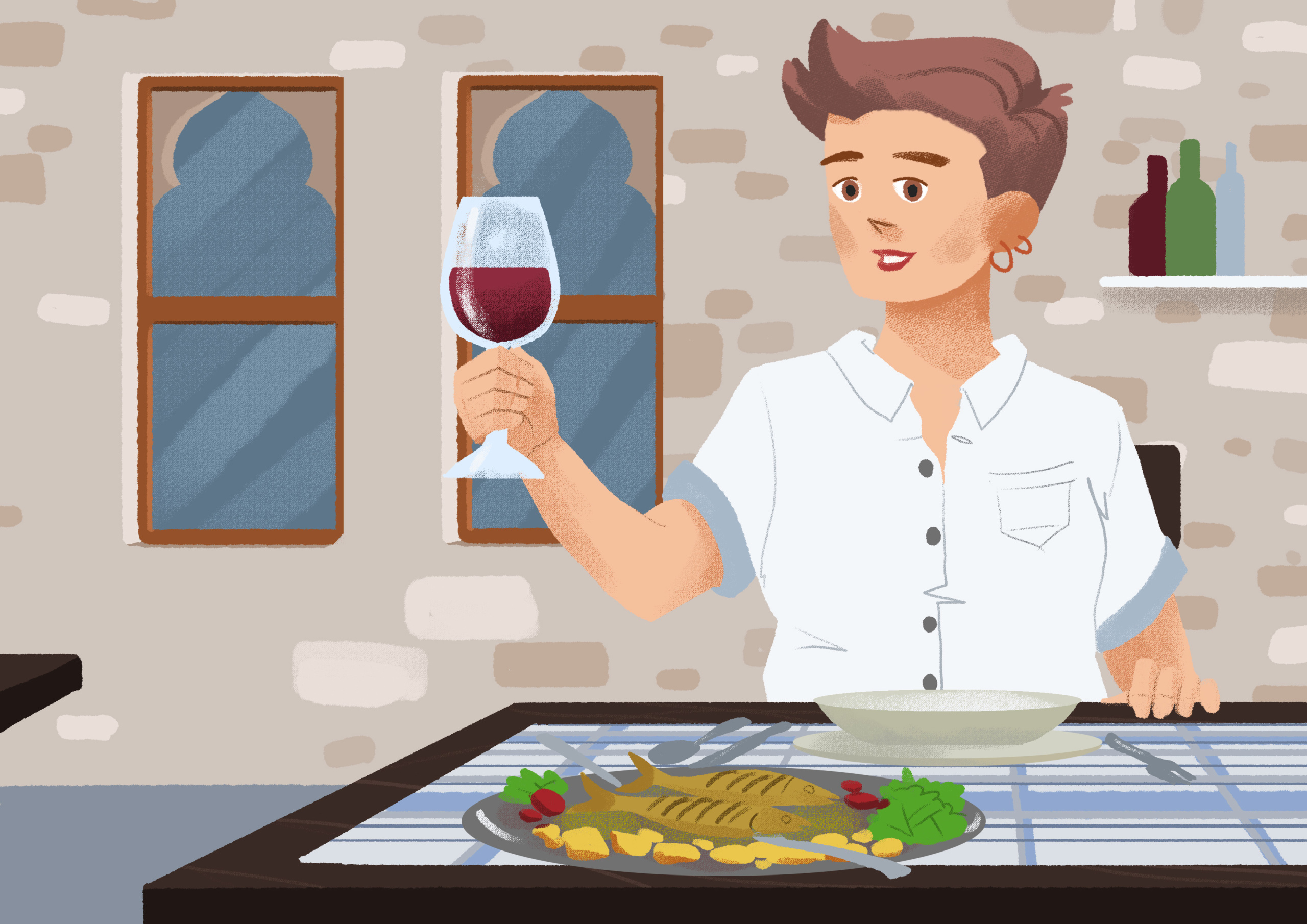 A woman sitting at a table holding up a wine glass with red wine with a soup plate in front of her. A plate with fish, potatoes, and greens is on the opposite side of the table.